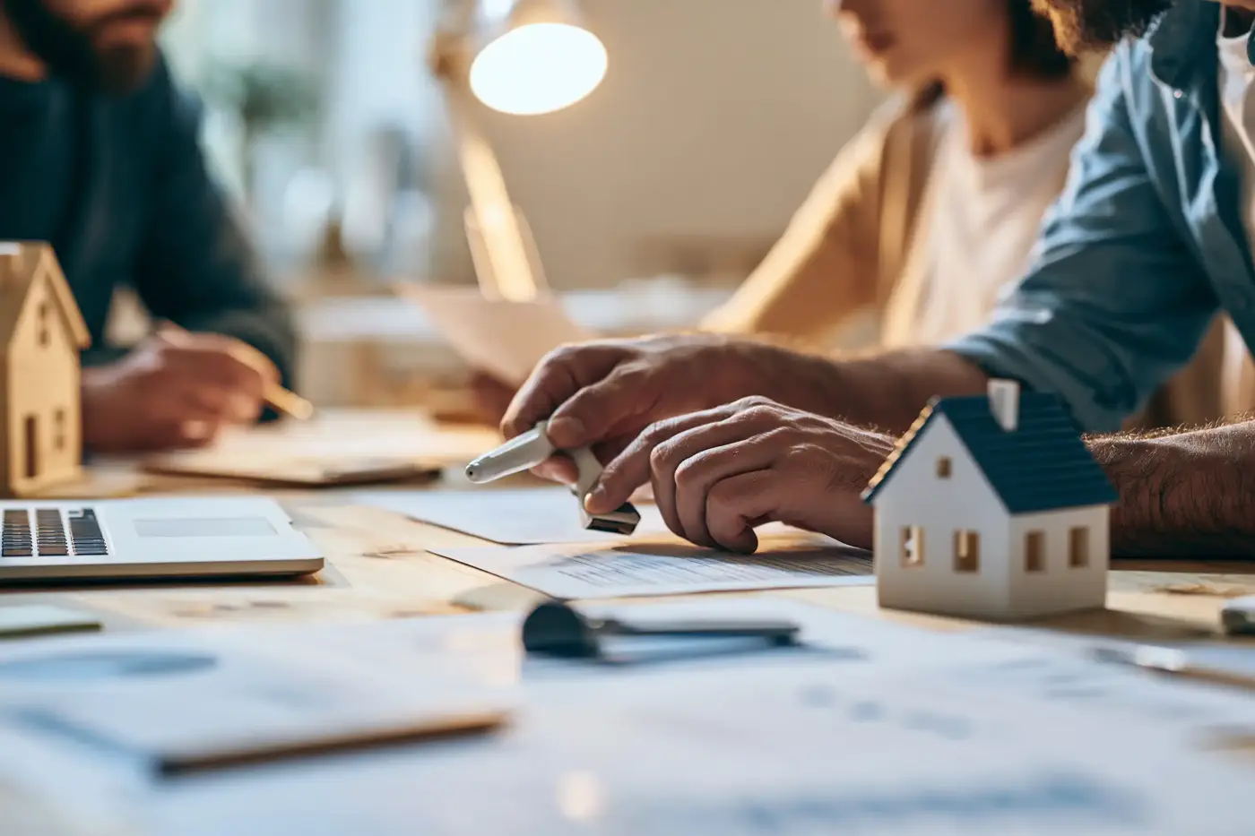 Self-employed borrower reviewing mortgage paperwork with a broker